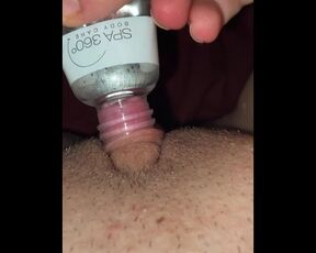 Horny and desperate girl uses a bottle to suck clit