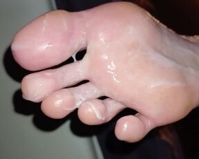 Eating cum off her oily soles after worshipping them