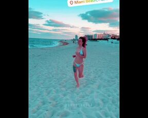 College girl runs on beach with her perfect little tittys out