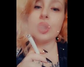 Girl with Fat Lips Smokes a Cigar