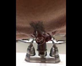 swinginmilf uses a sink to drain her sweet pussy of piss