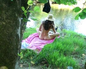 SOLO GIRL EXHIBITING OUTDOOR AT THE RIVER